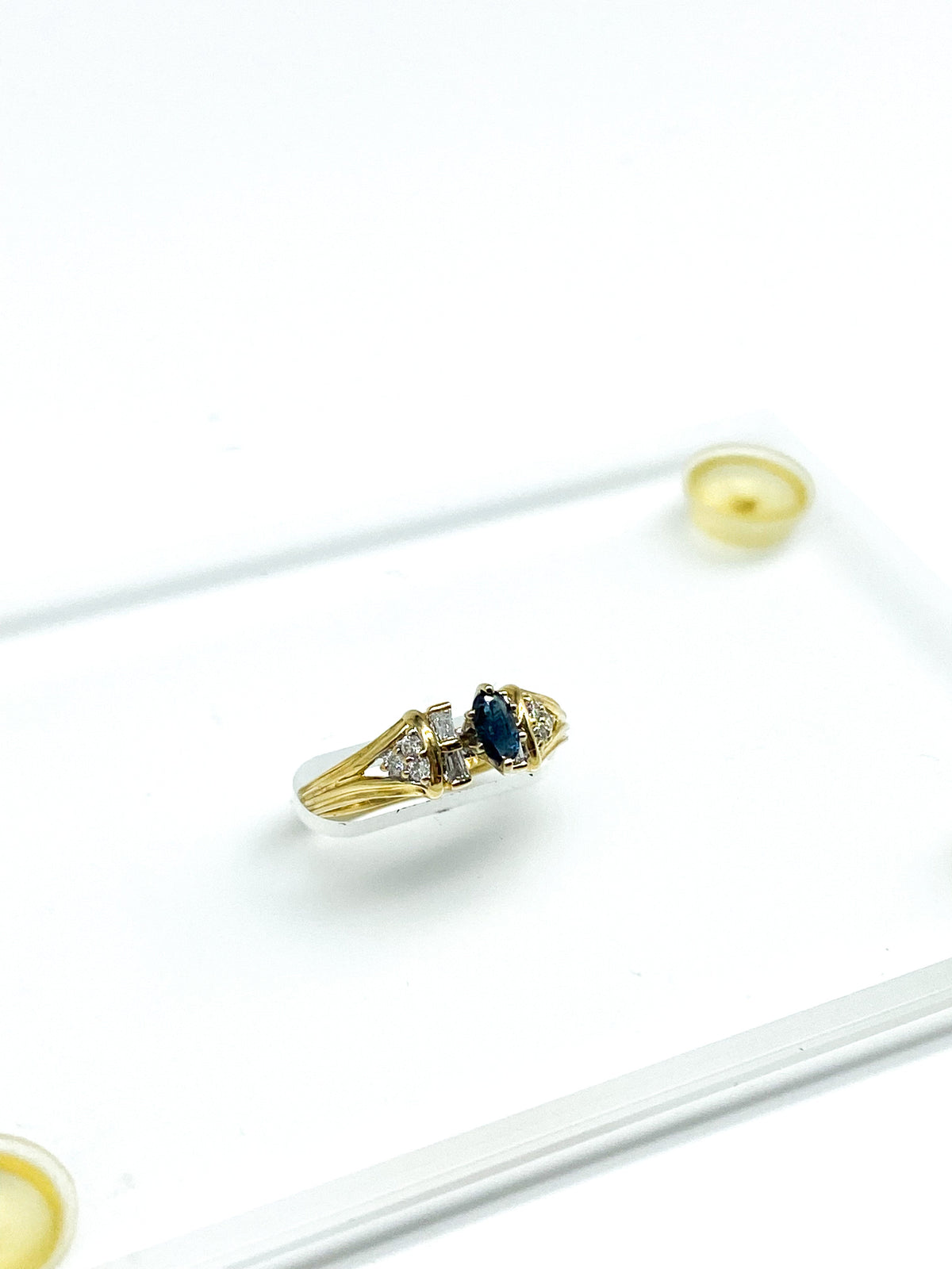 .16 Point Oval Cut,.12 Point Round Brilliant Cut and .12 Point Baguette Diamond Ring