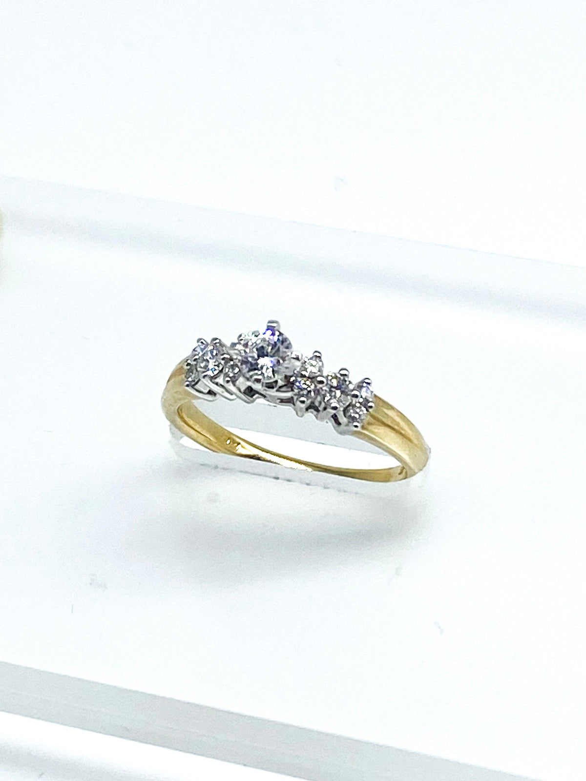 Cubic Zirconia Round Brilliant Cut and .20 Point Round Brilliant Diamond Ring