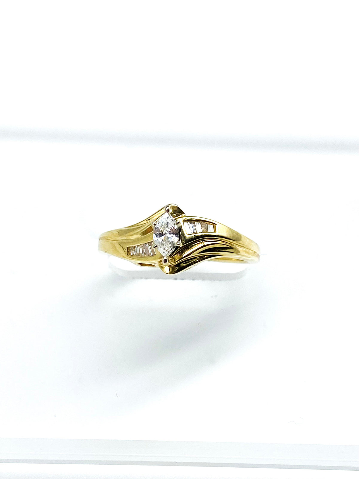 .18 Point Marquise Cut and .15 Point Baguette Cut Diamond Ring