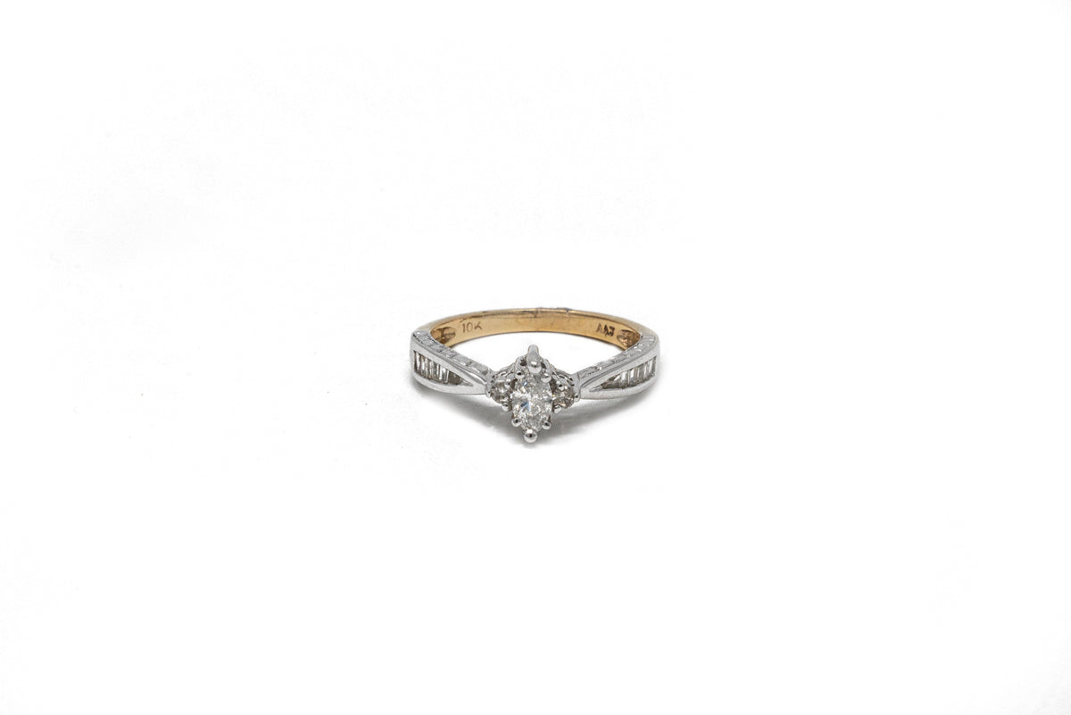 .30 point Marquise Cut and .24 point Tapered Baguettes Cut Diamond Ring