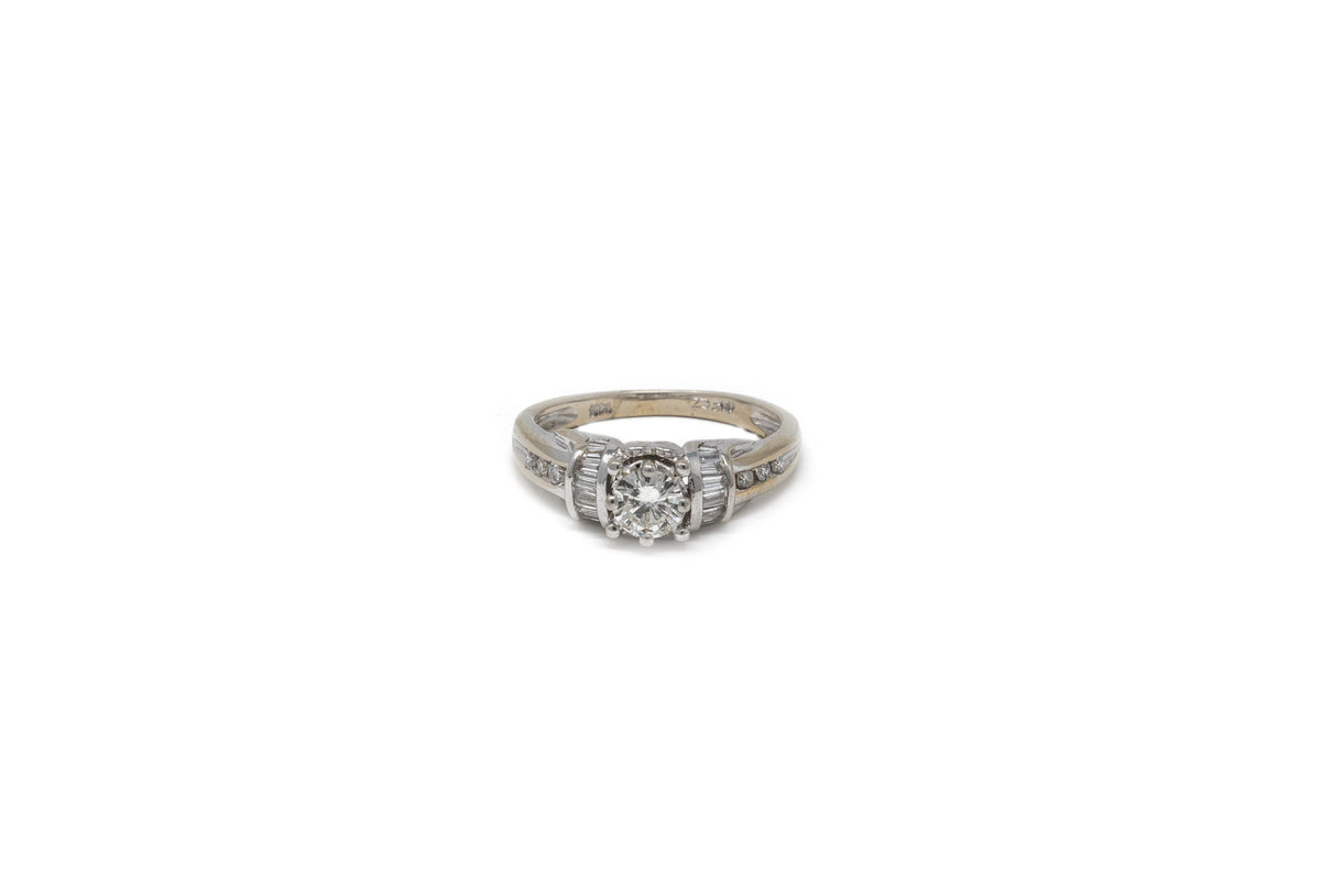 .30 point Round Brilliant Cut and .30 Round Brilliant/Baguette Cut Diamond Ring