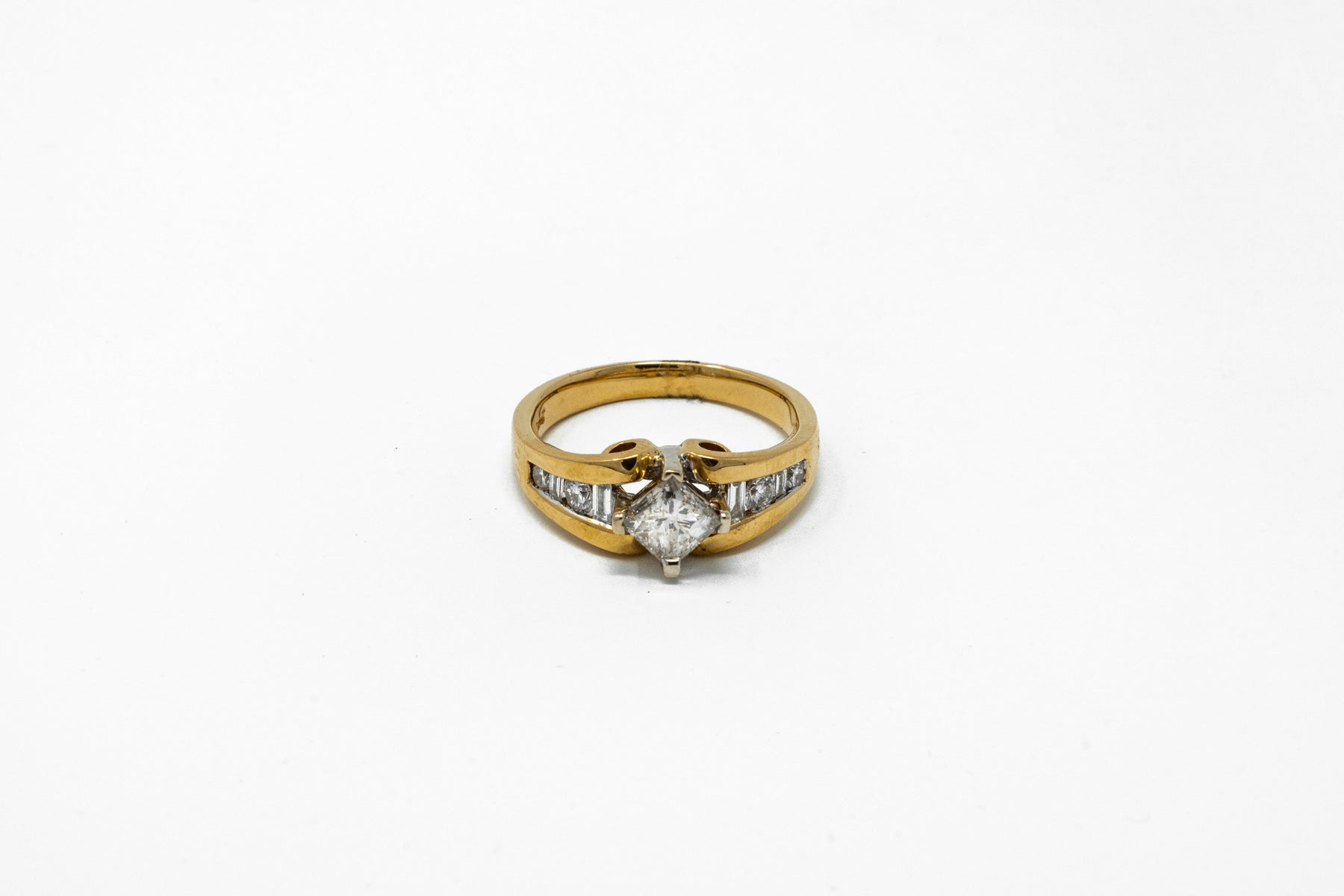 .73 point Princess Cut and .40 Round Brilliant/Baguette Cut Diamond Ring
