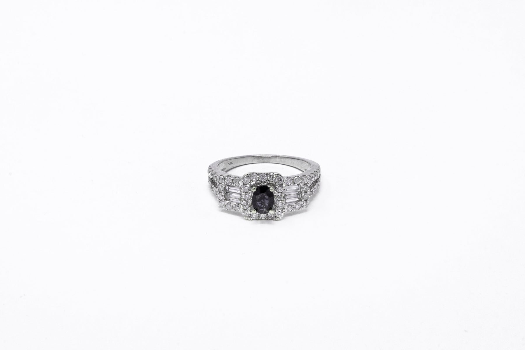 .50 point Oval Cut, .40 point Baguette Cut, and .78 point Round Brilliant Cut Diamond Ring