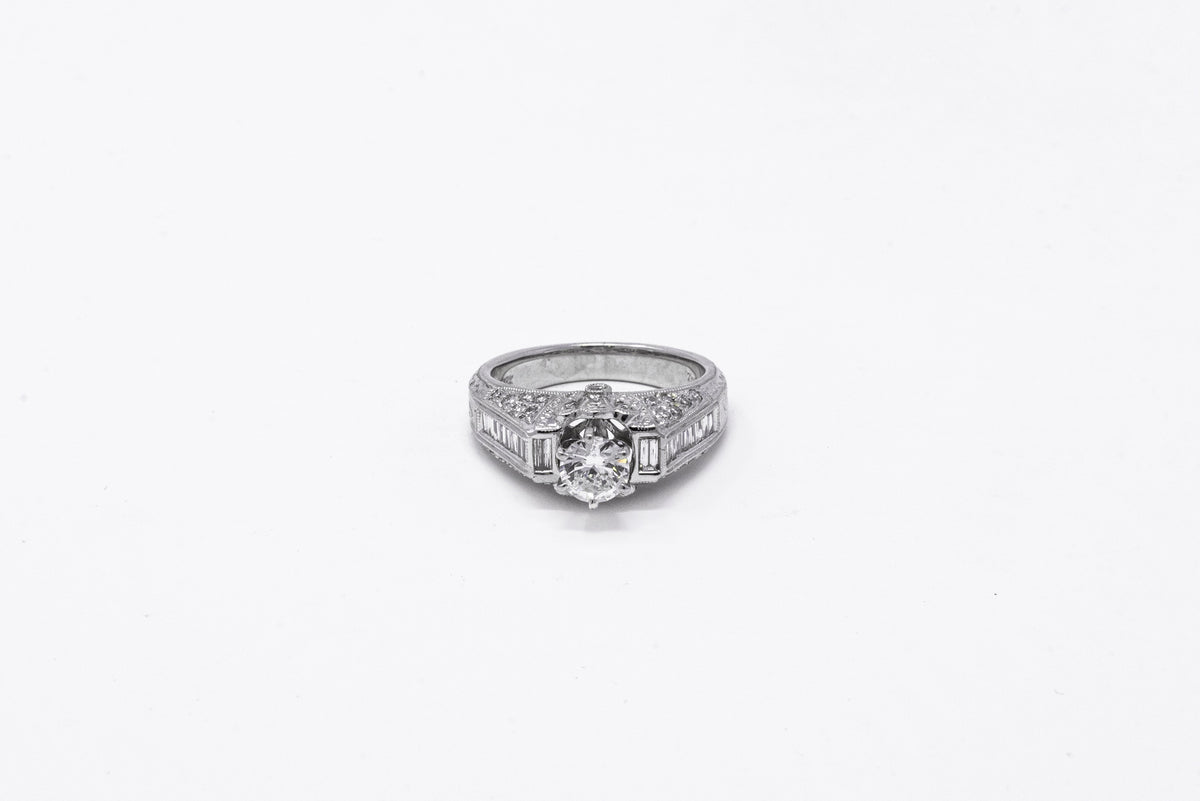 .58 point and .32 point Round Brilliant Cut and .14 point Tapered Baguette Cut Diamond Ring