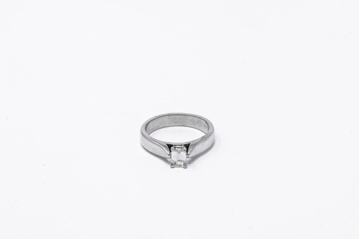 .39 point Round Brilliant Cut and .45 point Baguette Cut Diamond Ring