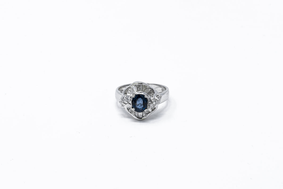 .60 point Oval Cut, .35 point Baguette Cut, and .15 point Round Brilliant Cut Diamond Ring