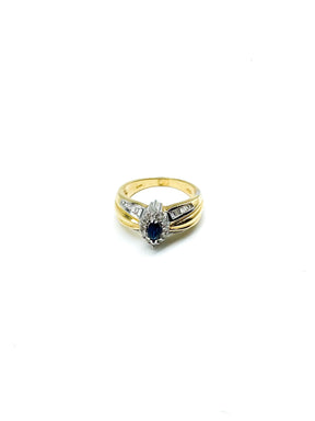 .35 Point Marquise Cut and .60 Point Round Brilliant and Baguette Diamond Ring