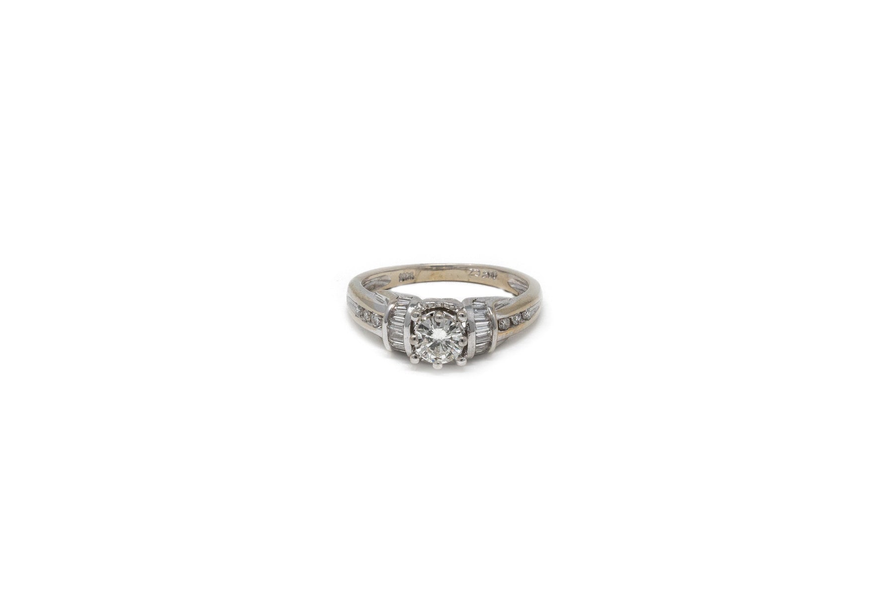 .30 point Round Brilliant Cut and .30 Round Brilliant/Baguette Cut Diamond Ring