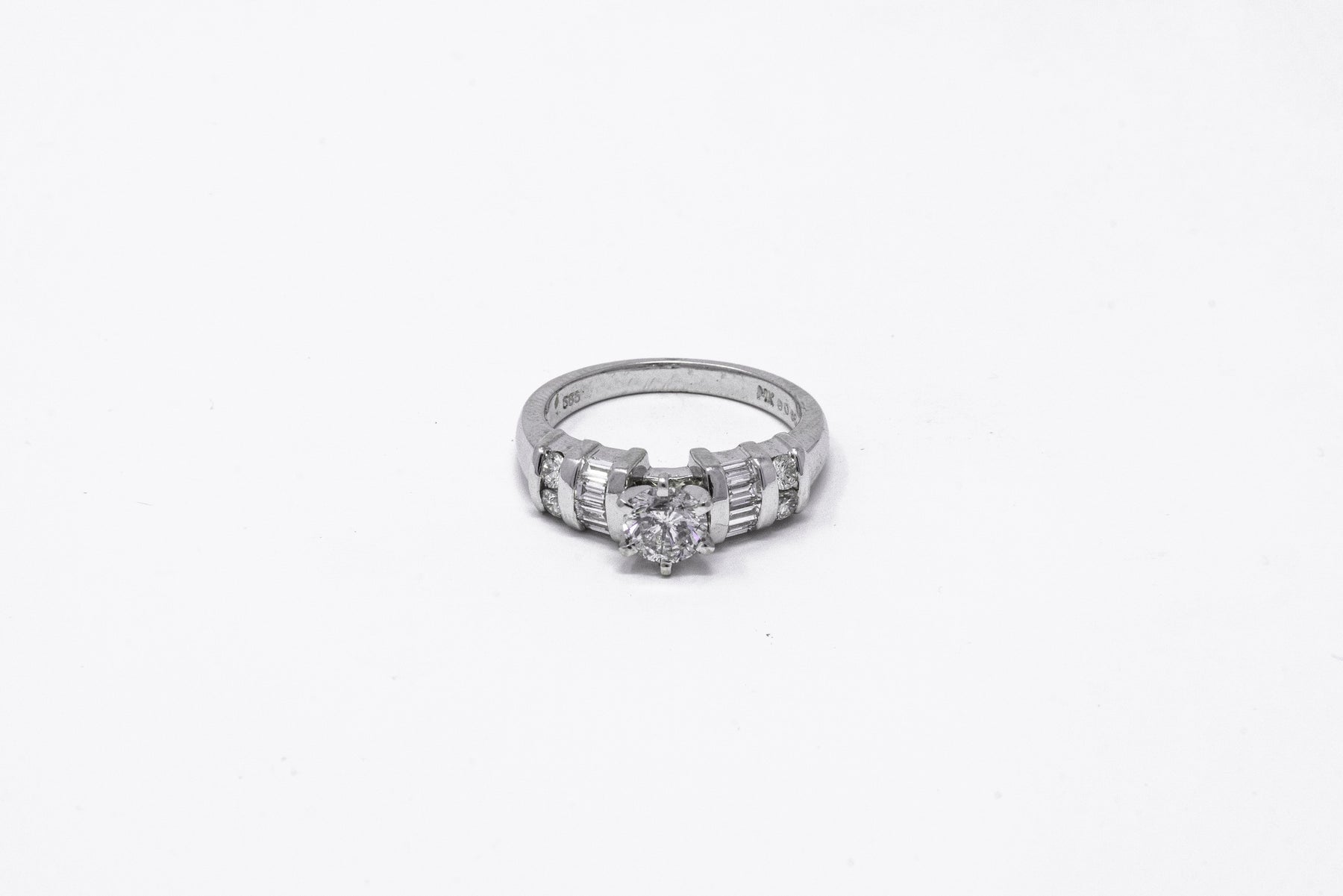 .66 point and .56 point Round Brilliant Cut Diamond Ring