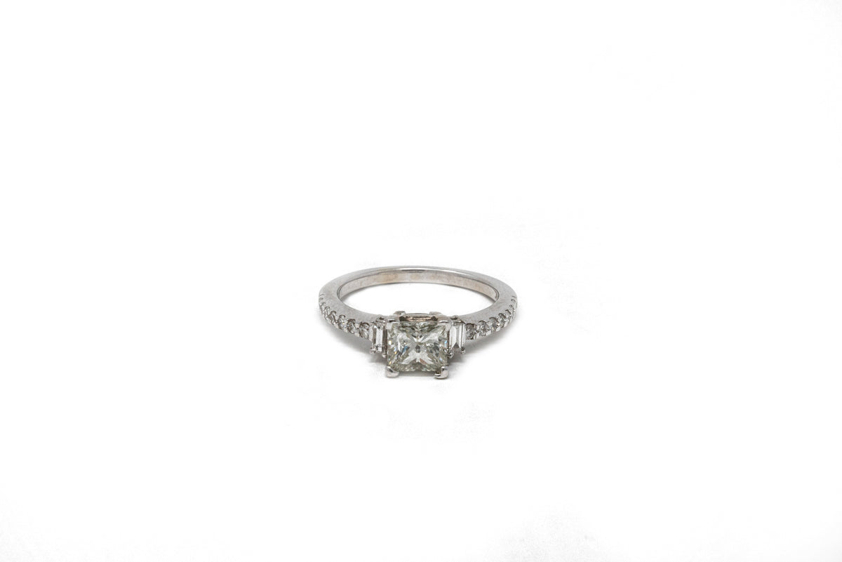 1.05 point Princess Cut, .14 point Tapered Baguette, and .21 point Round Brilliant Cut Diamond Ring