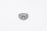 .58 point and .32 point Round Brilliant Cut and .14 point Tapered Baguette Cut Diamond Ring