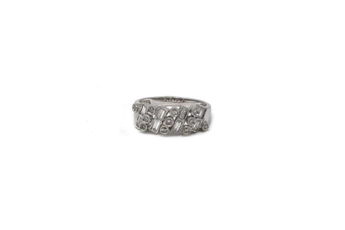 .40 point Baguette Cut and .10 point Round Single Cut Diamond Ring